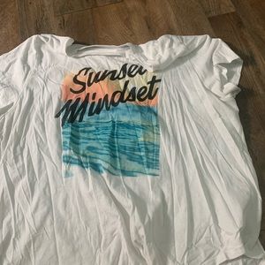 A white tee with a beach